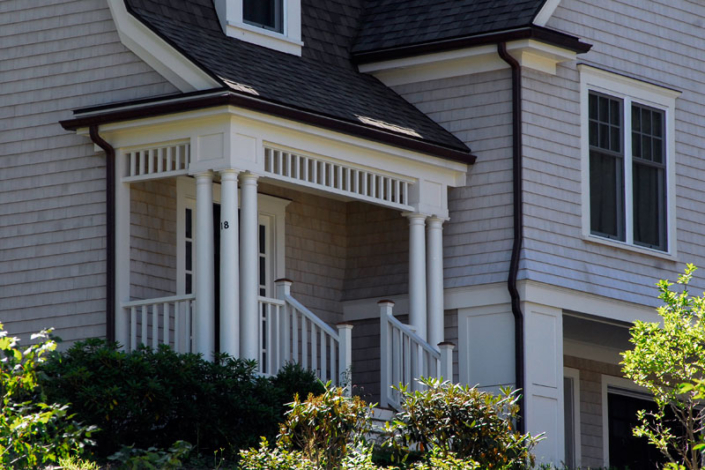 Custom porch eave with columns, posts & rails - Manchester MA